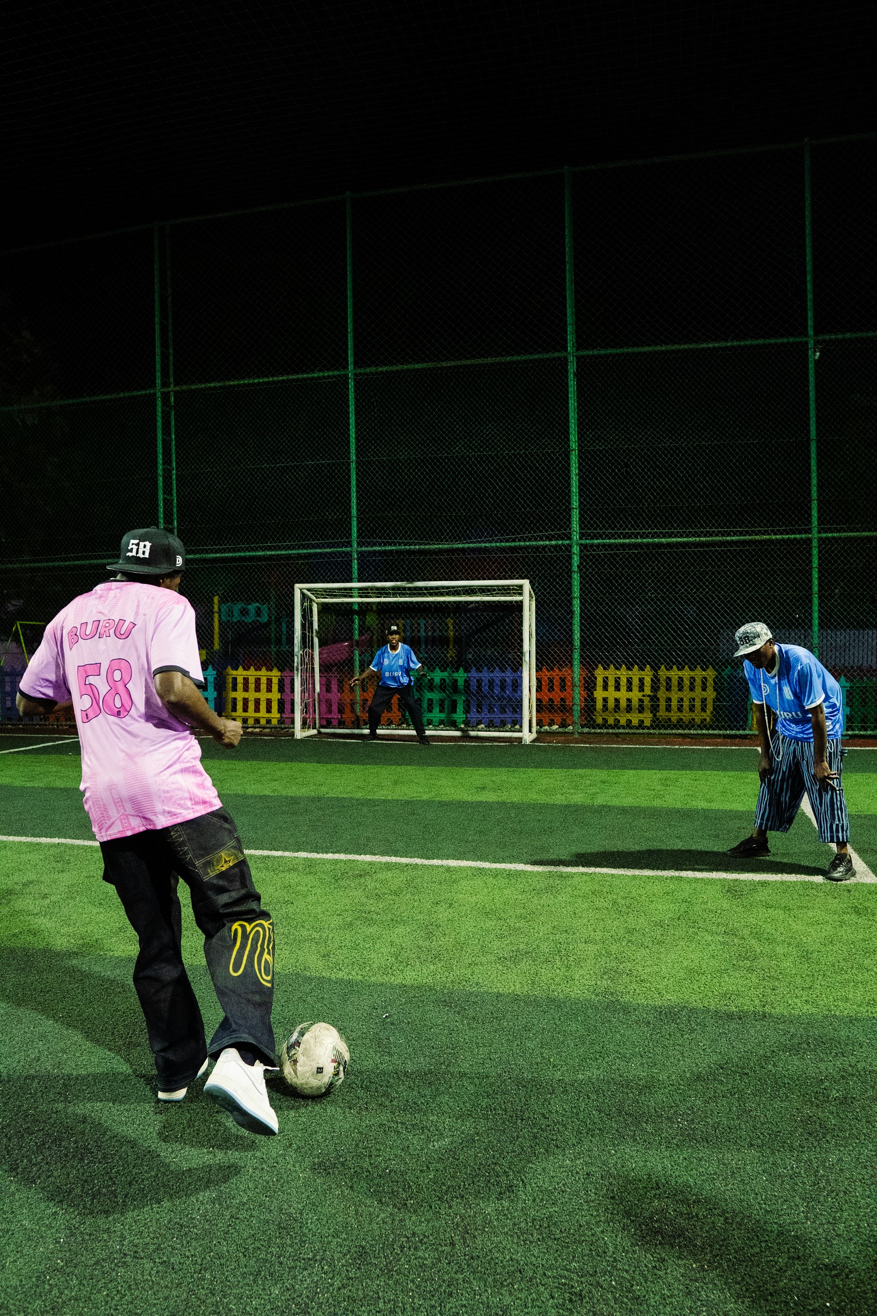 Players training under stadium lights in the 6